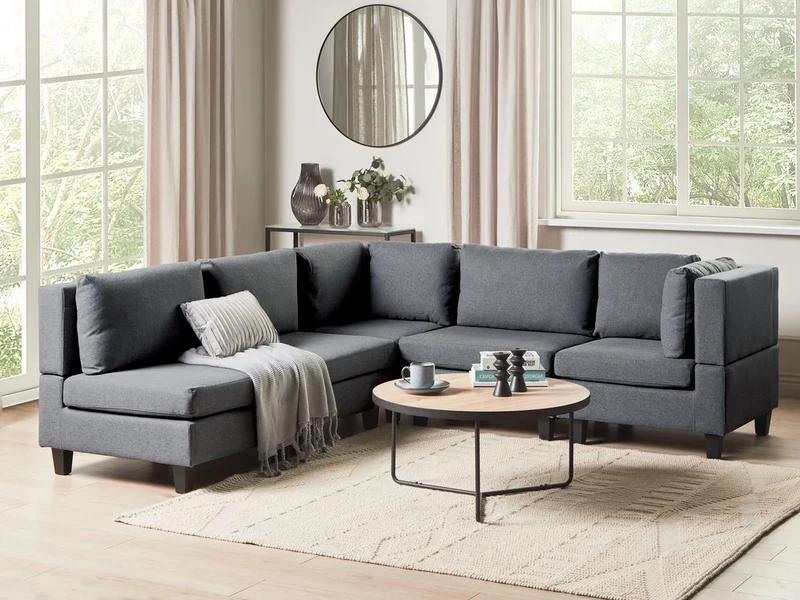 Divano componibile a 5 posti imbottito in tessuto grigio scuro gambe nere lato sinistro stile moderno