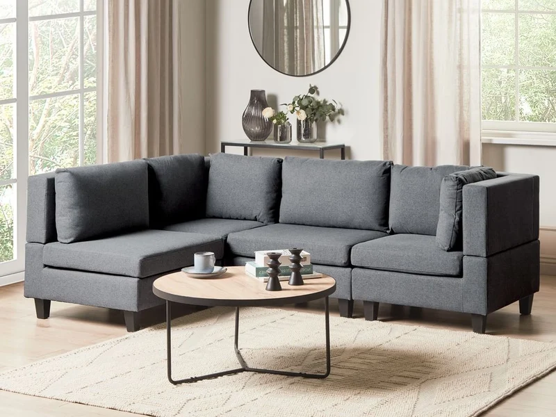 Divano componibile a 4 posti imbottito in tessuto grigio scuro gambe nere lato destro con ottomana stile moderno